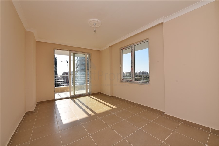 Трехкомнатная квартира в районе Махмутлар