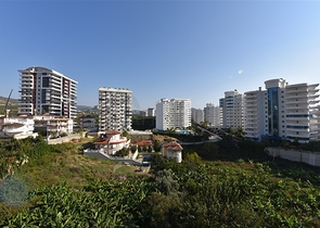 Трехкомнатная квартира в районе Махмутлар