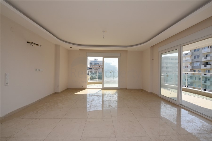 Трехкомнатная квартира в районе Махмутлар