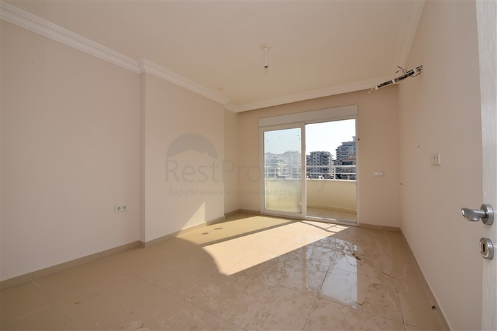 Трехкомнатная квартира в районе Махмутлар