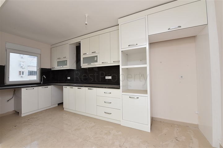 Трехкомнатная квартира в районе Махмутлар