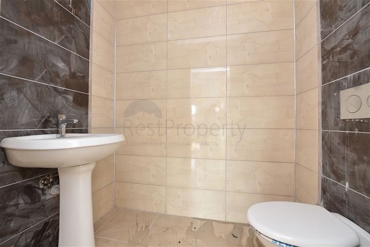 Трехкомнатная квартира в районе Махмутлар