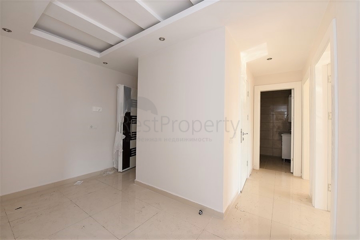 Трехкомнатная квартира в районе Махмутлар