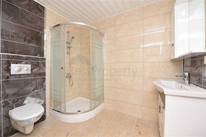 Трехкомнатная квартира в районе Махмутлар