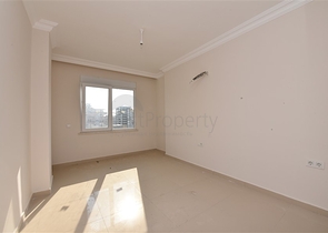 Трехкомнатная квартира в районе Махмутлар