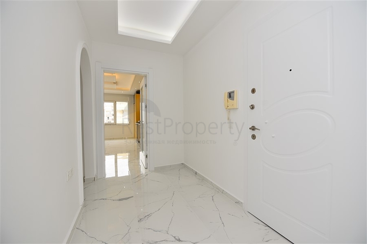 Трехкомнатная квартира в районе Махмутлар