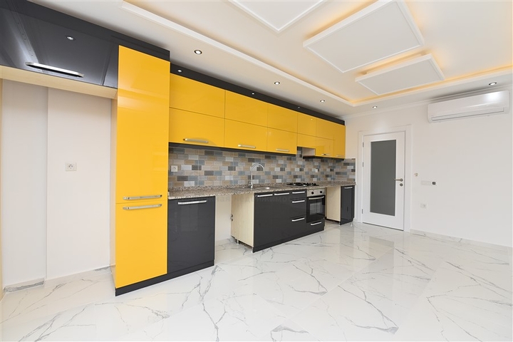 Трехкомнатная квартира в районе Махмутлар