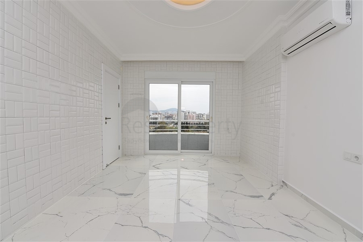 Трехкомнатная квартира в районе Махмутлар