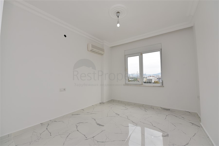 Трехкомнатная квартира в районе Махмутлар