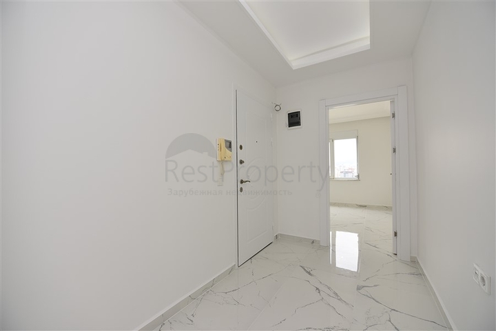 Трехкомнатная квартира в районе Махмутлар