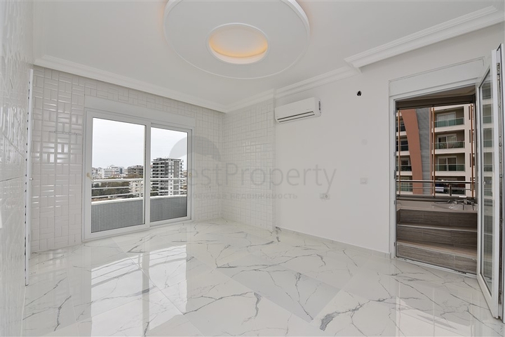 Трехкомнатная квартира в районе Махмутлар