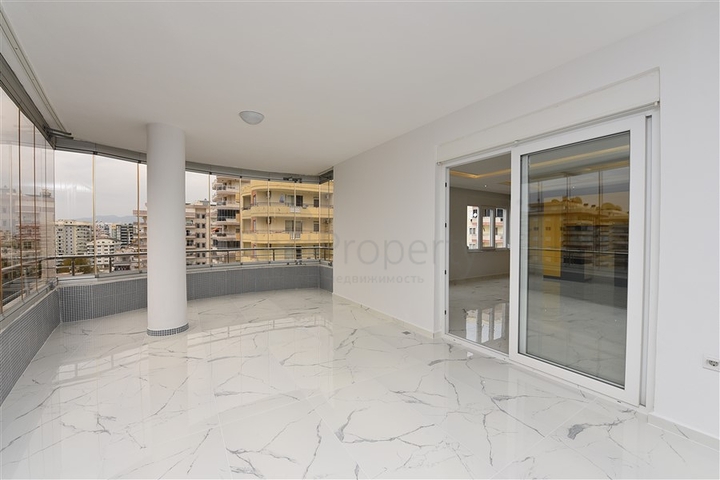 Трехкомнатная квартира в районе Махмутлар