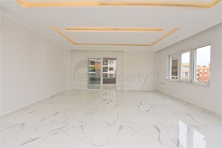 Трехкомнатная квартира в районе Махмутлар