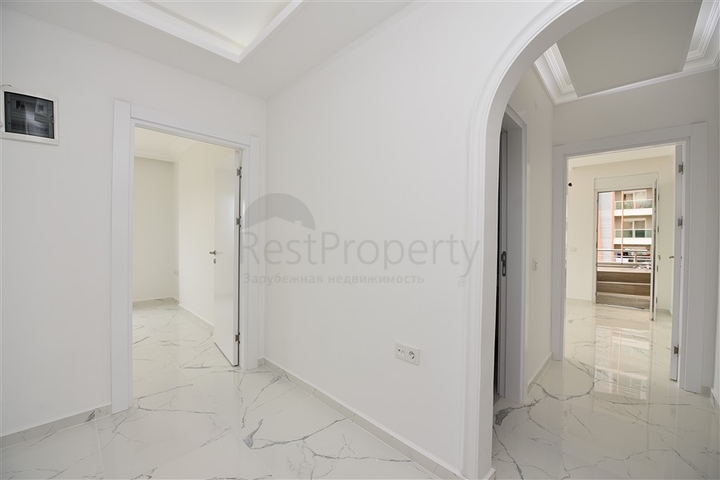 Трехкомнатная квартира в районе Махмутлар