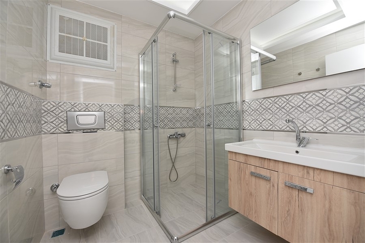 Трехкомнатная квартира в районе Махмутлар