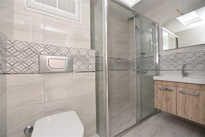 Трехкомнатная квартира в районе Махмутлар