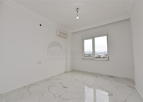 Трехкомнатная квартира в районе Махмутлар