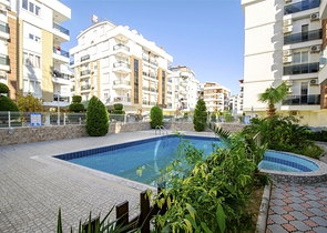 Трехкомнатная квартира в микрорайоне Хурма Коньяалты Анталья