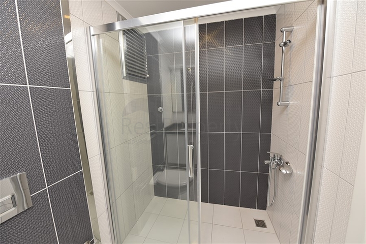 Двухкомнатная квартира в современном комплексе в Авсалларе