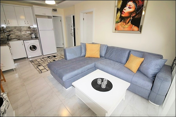 Меблированная квартира планировки 1+1 в районе Махмутлар