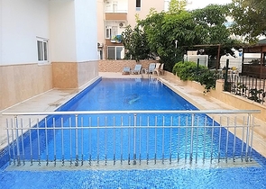 Квартира планировки 1+1 в районе Махмутлар