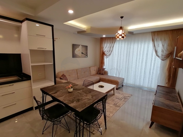 Меблированная квартира с одной спальней в Махмутларе