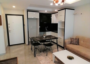 Меблированная квартира с одной спальней в Махмутларе