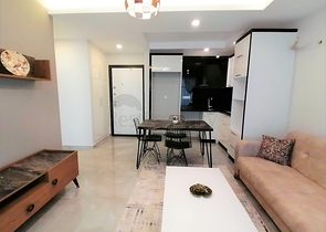 Меблированная квартира с одной спальней в Махмутларе