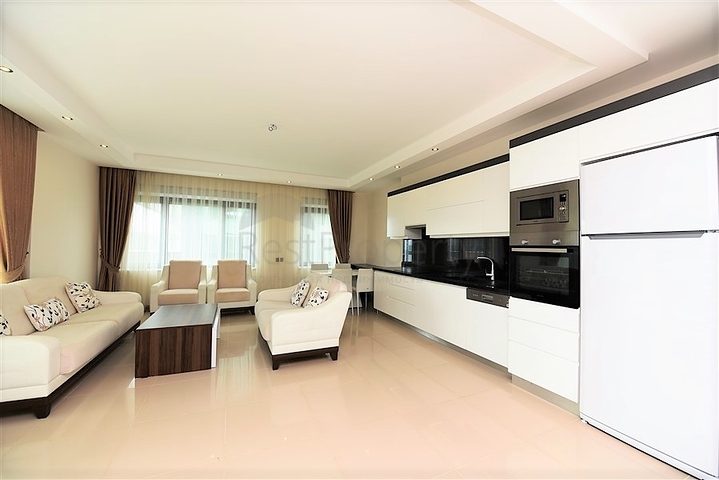 Меблированная квартира с двумя спальными комнатами в районе Каргыджак 