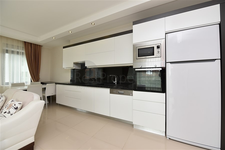 Меблированная квартира с двумя спальными комнатами в районе Каргыджак 