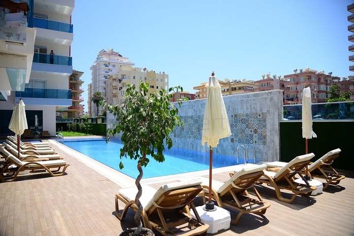 Меблированная квартира планировкой 1+1  в районе Махмутлар