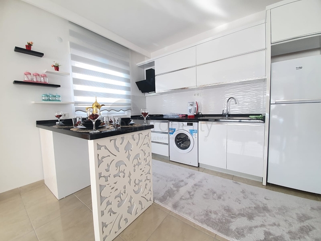 Меблированная квартира планировкой 1+1  в районе Махмутлар