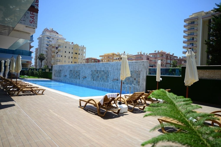 Меблированная квартира планировкой 1+1  в районе Махмутлар