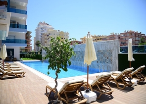 Меблированная квартира планировкой 1+1  в районе Махмутлар