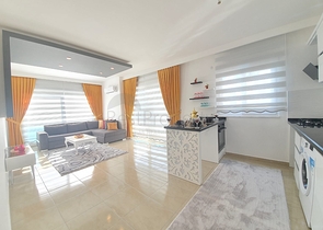 Меблированная квартира планировкой 1+1  в районе Махмутлар