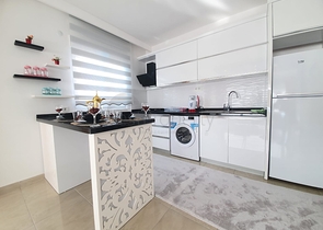 Меблированная квартира планировкой 1+1  в районе Махмутлар