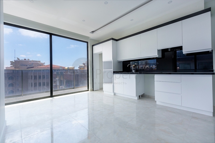 Апартаменты планировкой 2+1 в комплексе на первой береговой линии в Махмутлар