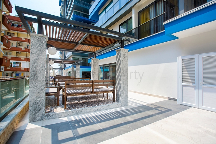 Апартаменты планировкой 2+1 в комплексе на первой береговой линии в Махмутлар