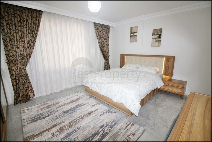 Трехкомнатная квартира с красивой мебелью в районе Махмутларе 