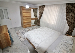 Трехкомнатная квартира с красивой мебелью в районе Махмутларе 