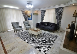 Трехкомнатная квартира с красивой мебелью в районе Махмутларе 