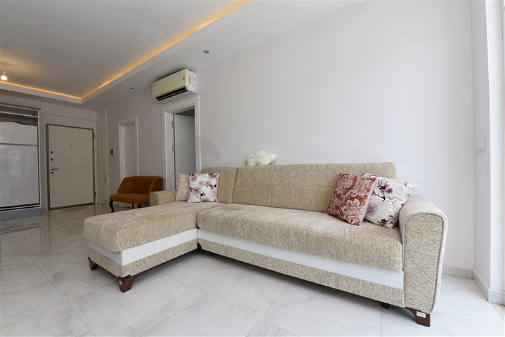 Двухкомнатная квартира в центре района Махмутлар 