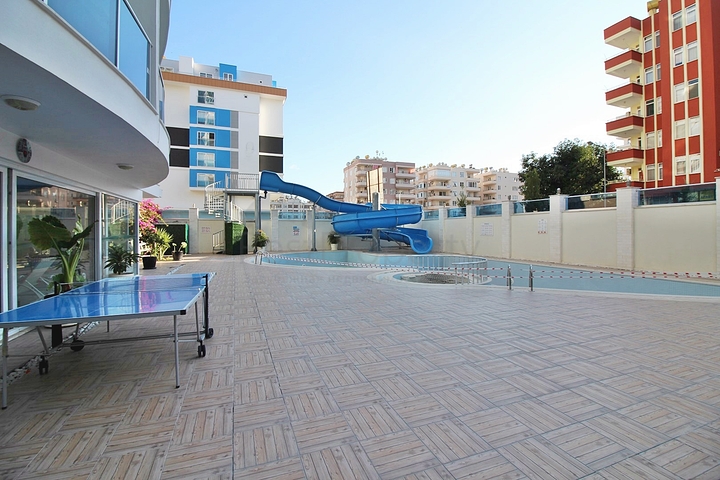 Двухкомнатная квартира в центре района Махмутлар 