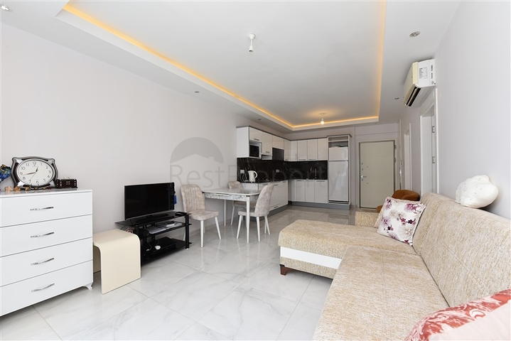 Двухкомнатная квартира в центре района Махмутлар 