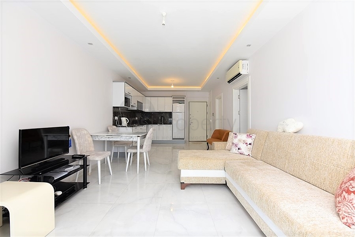 Двухкомнатная квартира в центре района Махмутлар 