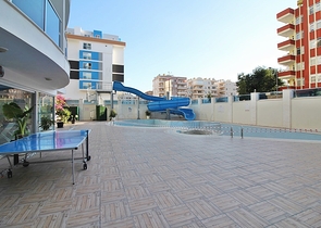 Двухкомнатная квартира в центре района Махмутлар 