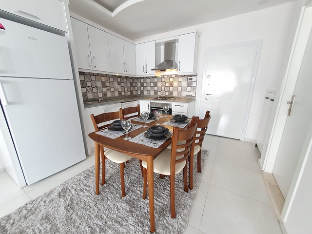 Меблированная двухкомнатная квартира в Махмутларе