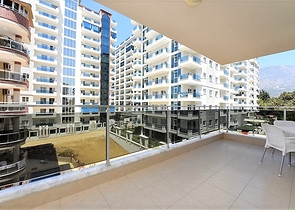 Меблированная квартира планировкой 1+1 в русскоязычном районе Махмутлар