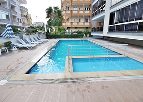 Меблированная квартира планировкой 1+1 в русскоязычном районе Махмутлар