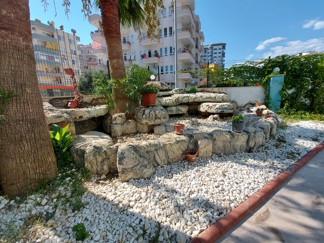 Меблированные апартаменты планировкой 1+1 в районе Махмутлар